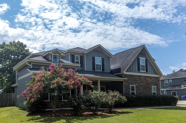 7514 Garrett Rd, Midland, GA 31820 - craftsman house with covered porch, board and batten siding, and stone siding