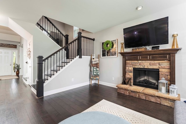 7514 Garrett Rd, Midland, GA 31820 - living room with wood-type flooring, stairs, a fireplace, and recessed lighting