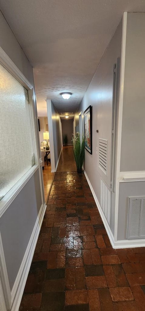 7400 Standing Boy Rd, Columbus, GA 31904 - hallway featuring brick floors and baseboards
