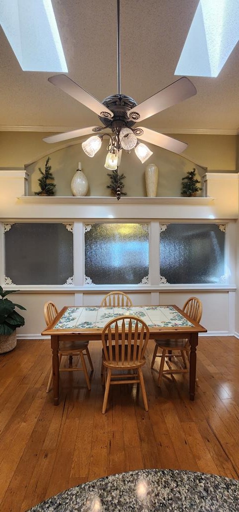 7400 Standing Boy Rd, Columbus, GA 31904 - dining area view of wood finished floors, a skylight, a ceiling fan, and a textured ceiling