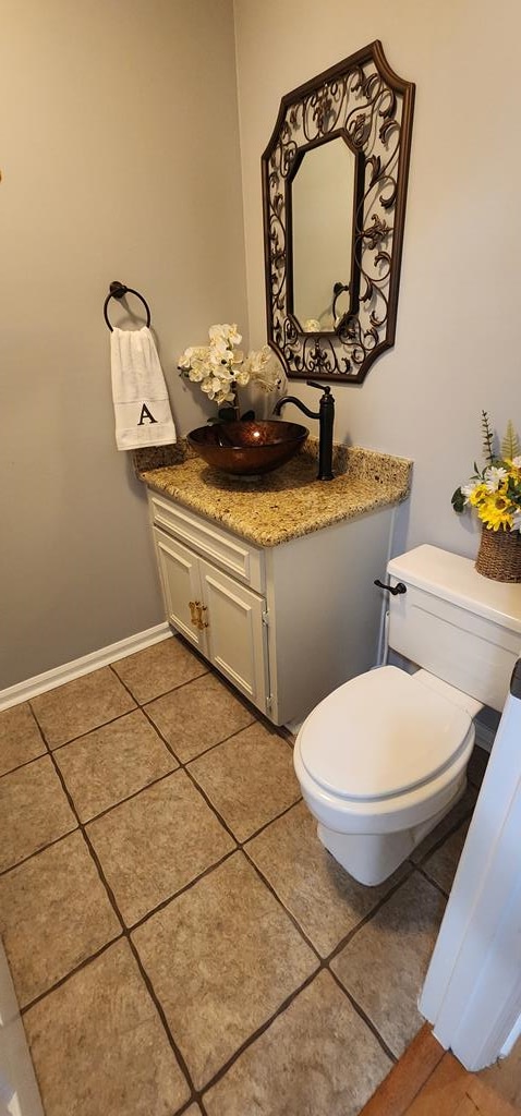 7400 Standing Boy Rd, Columbus, GA 31904 - half bathroom with vanity and tile patterned flooring