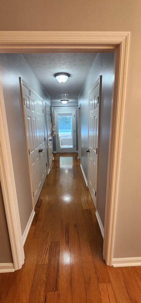 7400 Standing Boy Rd, Columbus, GA 31904 - corridor with wood-type flooring and baseboards
