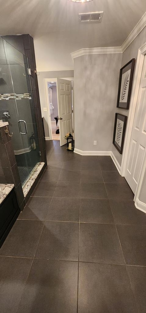 7400 Standing Boy Rd, Columbus, GA 31904 - hall with dark tile patterned floors and ornamental molding