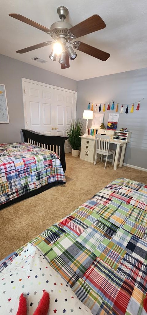7400 Standing Boy Rd, Columbus, GA 31904 - bedroom with light colored carpet, ceiling fan, and a closet