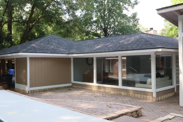 7400 Standing Boy Rd, Columbus, GA 31904 - back of property featuring a shingled roof, a chimney, and a patio area