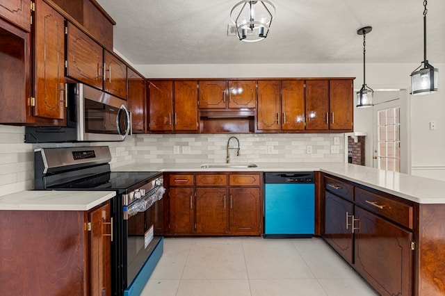 4658 Thoroughbred Ln, Columbus, GA 31909 - kitchen with stainless steel appliances, a peninsula, tasteful backsplash, light countertops, and decorative light fixtures