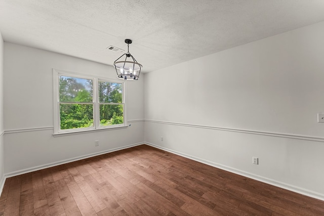 4658 Thoroughbred Ln, Columbus, GA 31909 - spare room with wood finished floors, a chandelier, and a textured ceiling