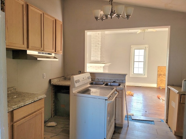 washroom with washer / clothes dryer, an inviting chandelier, light wood-style floors, a sink, and laundry area