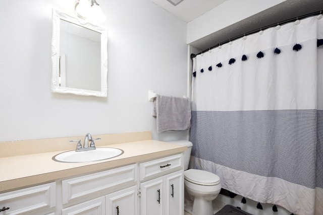 bathroom featuring vanity, a shower with curtain, and toilet