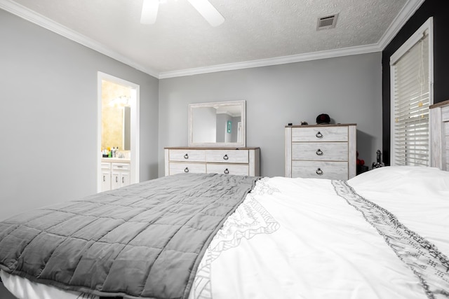 bedroom with crown molding, a textured ceiling, ceiling fan, and ensuite bathroom