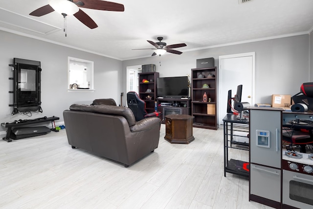 living room featuring ceiling fan, ornamental molding, and light hardwood / wood-style flooring