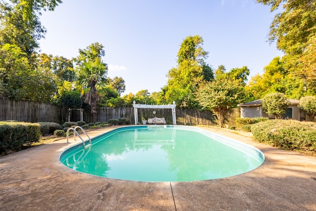 view of swimming pool with a pergola