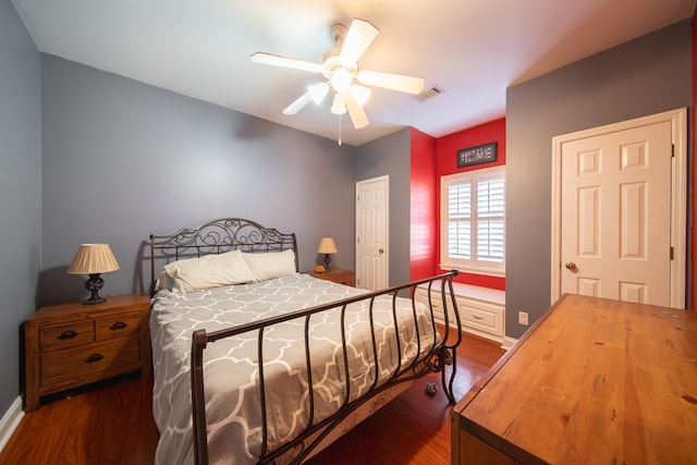 bedroom featuring dark hardwood / wood-style flooring and ceiling fan