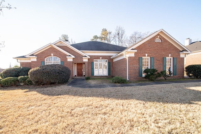 ranch-style house with a front yard