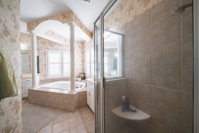 bathroom with vanity, independent shower and bath, tile patterned flooring, and ornate columns