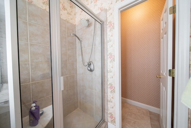 bathroom featuring a shower with door