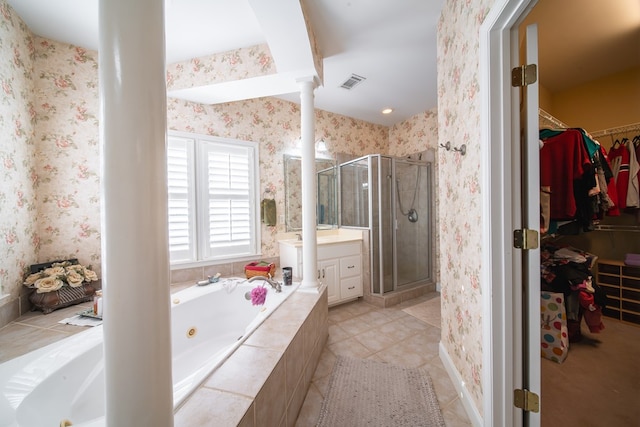 bathroom with ornate columns, vanity, separate shower and tub, and tile patterned floors