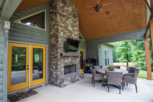 299 Savior Ln, Hamilton, GA 31811 - view of patio / terrace with an outdoor stone fireplace, outdoor dining area, french doors, and ceiling fan