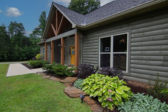 299 Savior Ln, Hamilton, GA 31811 - view of home's exterior featuring roof with shingles and a lawn