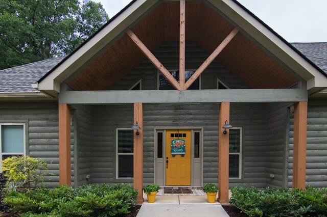 299 Savior Ln, Hamilton, GA 31811 - entrance to property with a shingled roof, faux log siding, and a porch
