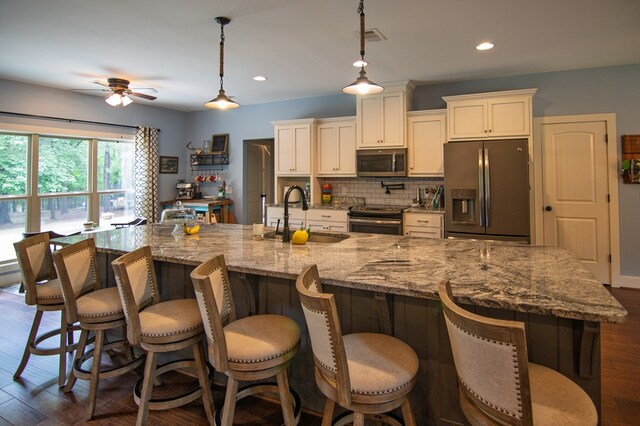 299 Savior Ln, Hamilton, GA 31811 - kitchen featuring stainless steel appliances, a ceiling fan, backsplash, white cabinets, and recessed lighting