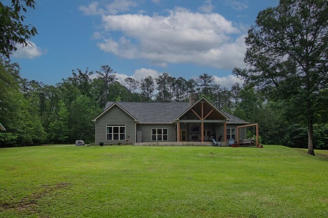 299 Savior Ln, Hamilton, GA 31811 - back of property featuring a chimney and a yard