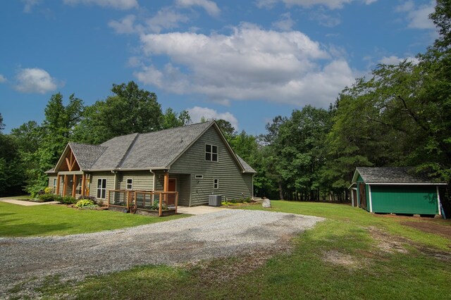 299 Savior Ln, Hamilton, GA 31811 - view of front of property with a shed, a front lawn, a wooden deck, and gravel driveway