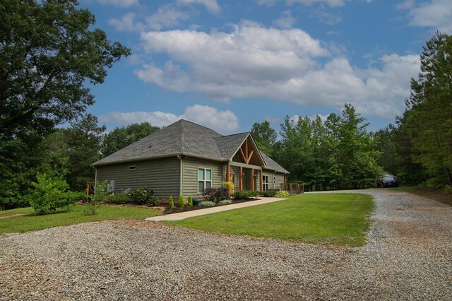 299 Savior Ln, Hamilton, GA 31811 - view of property exterior featuring driveway, a yard, and a shingled roof