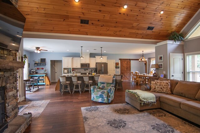 299 Savior Ln, Hamilton, GA 31811 - living room with recessed lighting, a stone fireplace, dark wood finished floors, high vaulted ceiling, and ceiling fan
