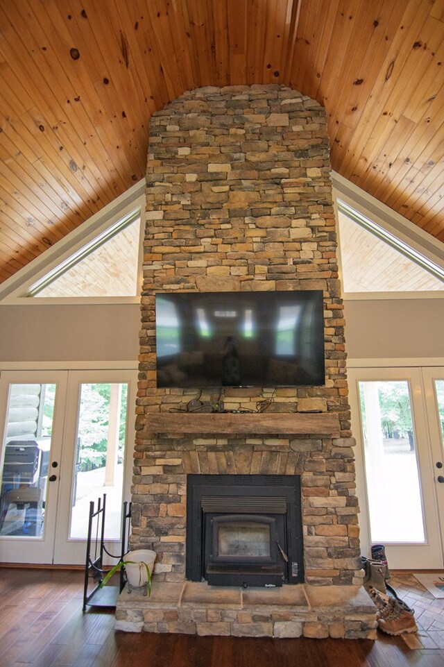 299 Savior Ln, Hamilton, GA 31811 - detailed view of french doors, wooden ceiling, a stone fireplace, and wood finished floors