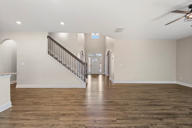 254 Clearbrook Ln, Columbus, GA 31904 - entrance foyer featuring a ceiling fan, arched walkways, dark wood-style floors, baseboards, and stairway