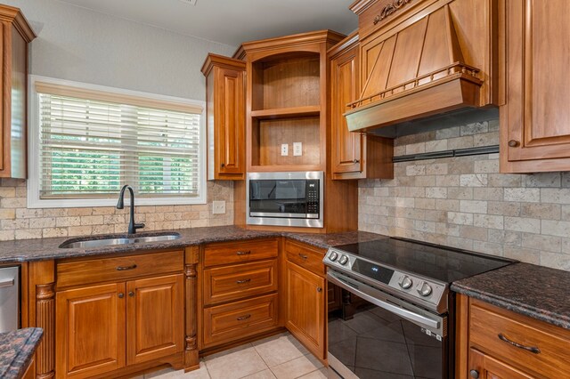 30 Pleasant Ct, Cataula, GA 31804 - kitchen featuring appliances with stainless steel finishes, custom range hood, brown cabinetry, and tasteful backsplash