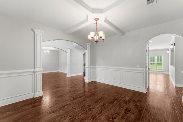 30 Pleasant Ct, Cataula, GA 31804 - spare room featuring arched walkways, a chandelier, dark wood-style flooring, beam ceiling, and wainscoting