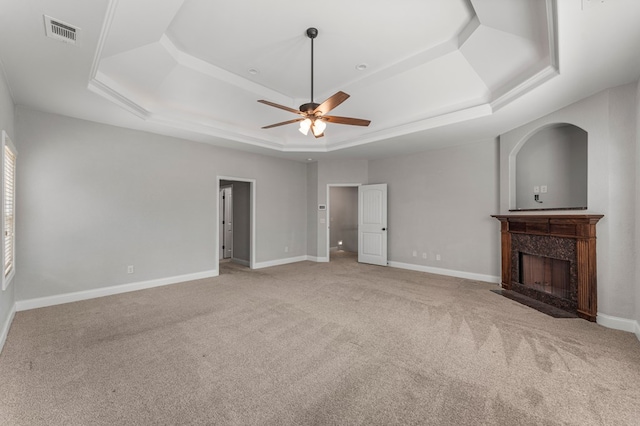 30 Pleasant Ct, Cataula, GA 31804 - unfurnished living room featuring a raised ceiling, a ceiling fan, carpet flooring, and a high end fireplace