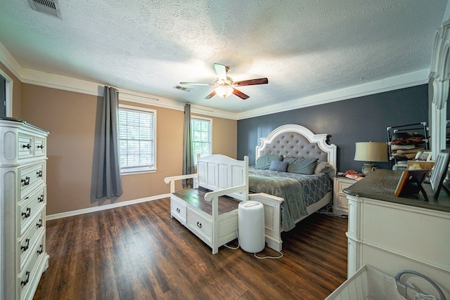 bedroom with dark wood finished floors, visible vents, and a textured ceiling