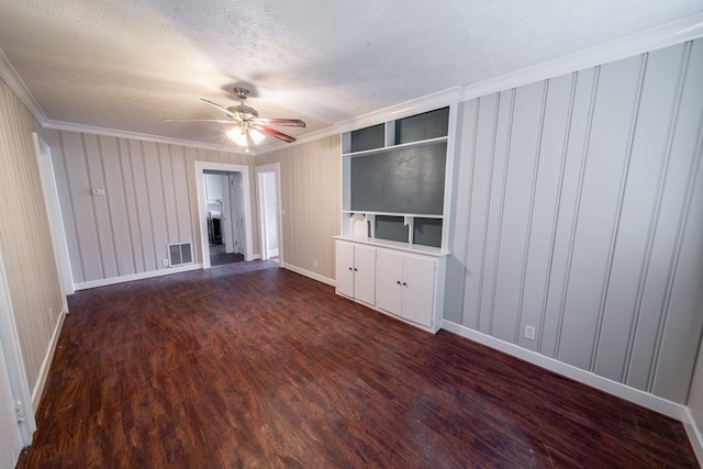 unfurnished living room with ornamental molding, ceiling fan, a textured ceiling, and dark hardwood / wood-style flooring