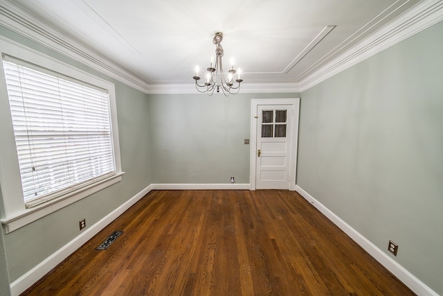 interior space featuring an inviting chandelier, ornamental molding, and dark hardwood / wood-style floors