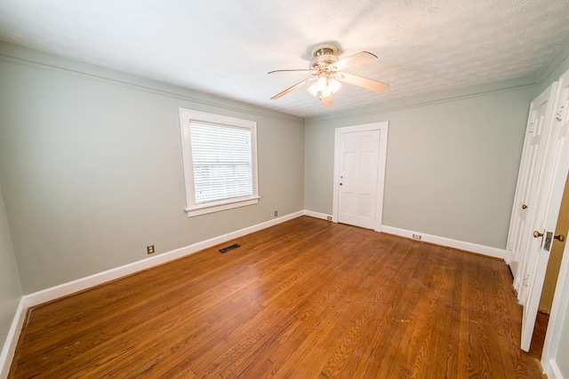 unfurnished room with hardwood / wood-style flooring and ceiling fan