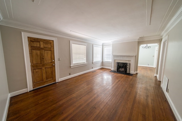 unfurnished living room with crown molding and dark hardwood / wood-style floors