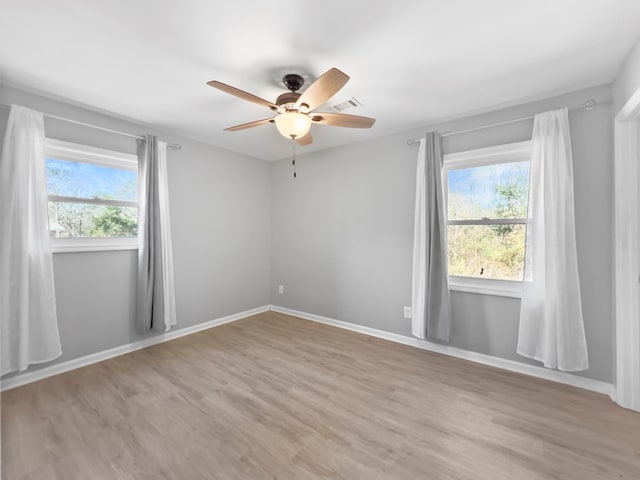 unfurnished room featuring ceiling fan and light hardwood / wood-style floors