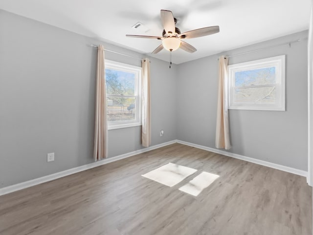 unfurnished room featuring light hardwood / wood-style floors and ceiling fan