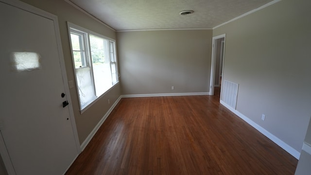 4525 Sentry St, Columbus, GA 31907 - empty room featuring ornamental molding, dark wood-type flooring, and a textured ceiling