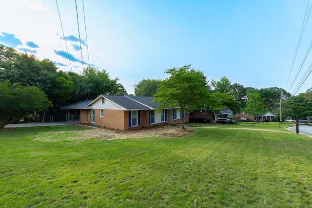 3068 Apache Dr, Columbus, GA 31909 - view of side of property featuring a yard and brick siding