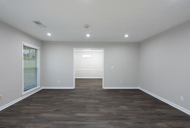 3068 Apache Dr, Columbus, GA 31909 - empty room featuring dark wood-style floors, recessed lighting, baseboards, and a chandelier