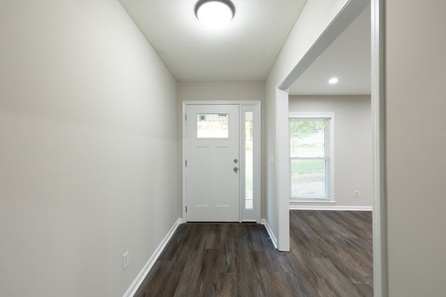 3068 Apache Dr, Columbus, GA 31909 - entrance foyer featuring dark wood-style flooring, baseboards, and a textured ceiling