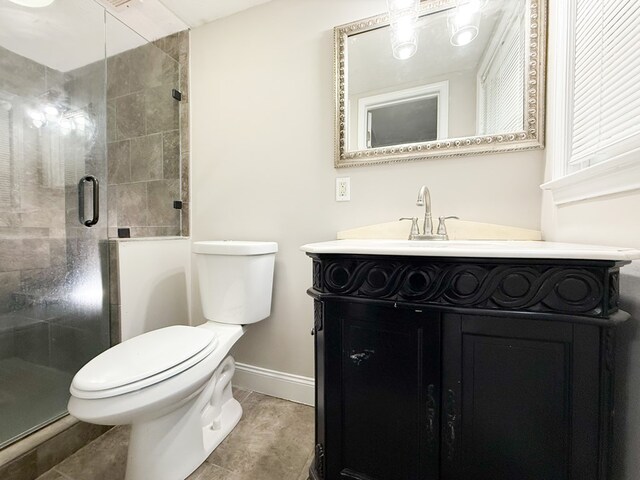 3068 Apache Dr, Columbus, GA 31909 - bathroom featuring toilet, vanity, baseboards, and a stall shower