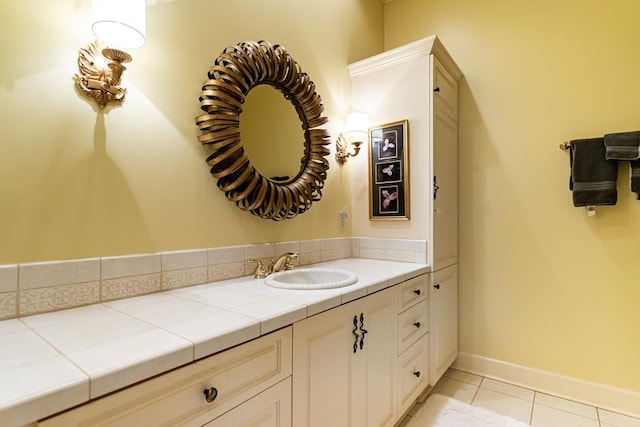 bathroom with tile patterned floors and vanity