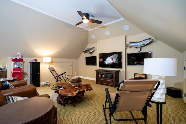 carpeted cinema with ornamental molding, lofted ceiling, and ceiling fan