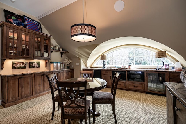 dining area featuring light colored carpet and beverage cooler