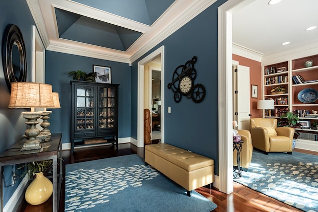 interior space featuring crown molding, built in features, and dark hardwood / wood-style flooring